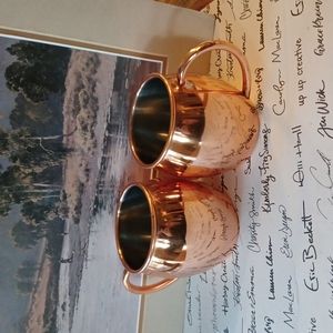 Two copper mugs